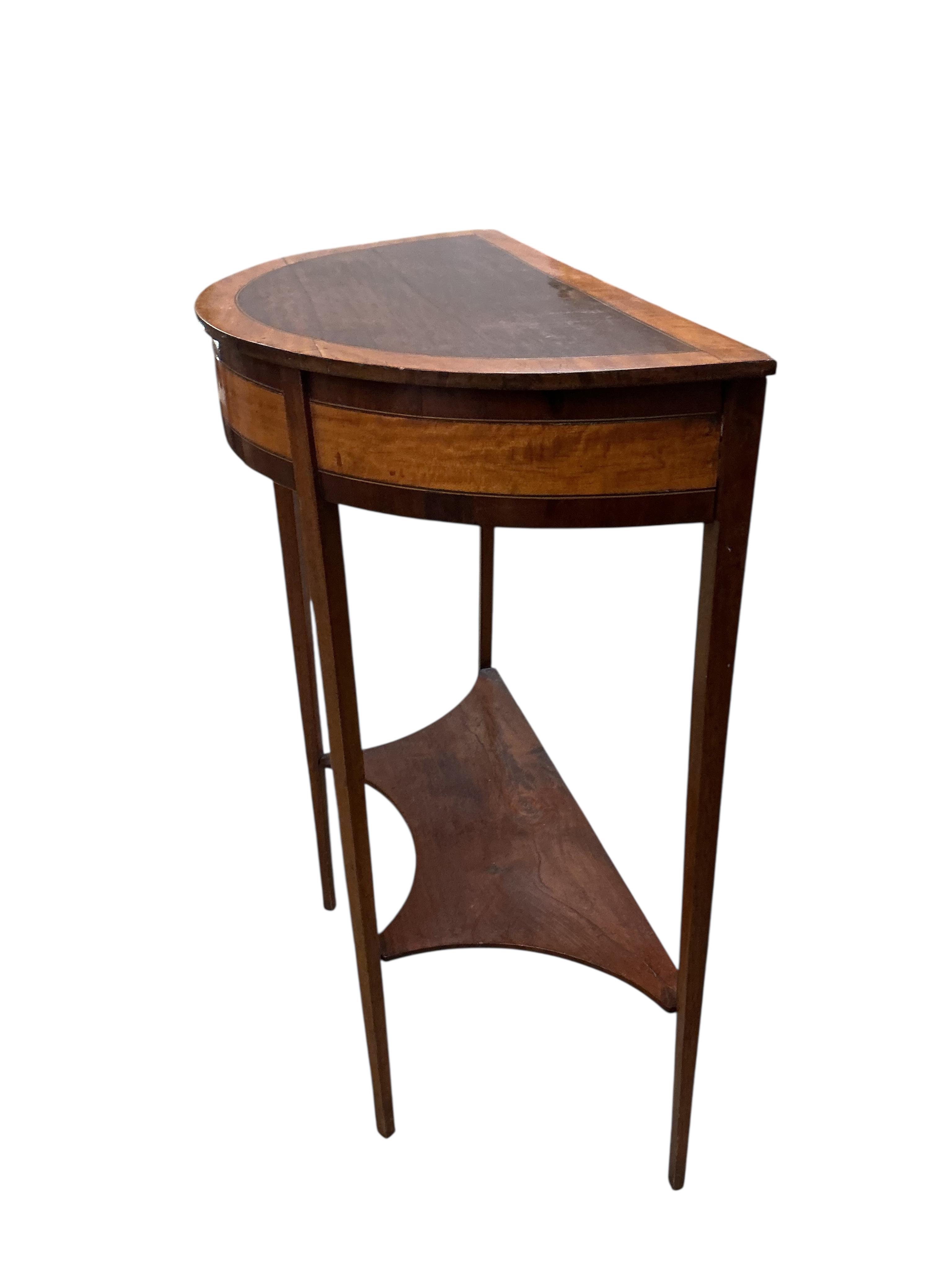 A George III style satinwood banded inlaid demi-lune two tier table, width 64cm, depth 32cm, height 77cm